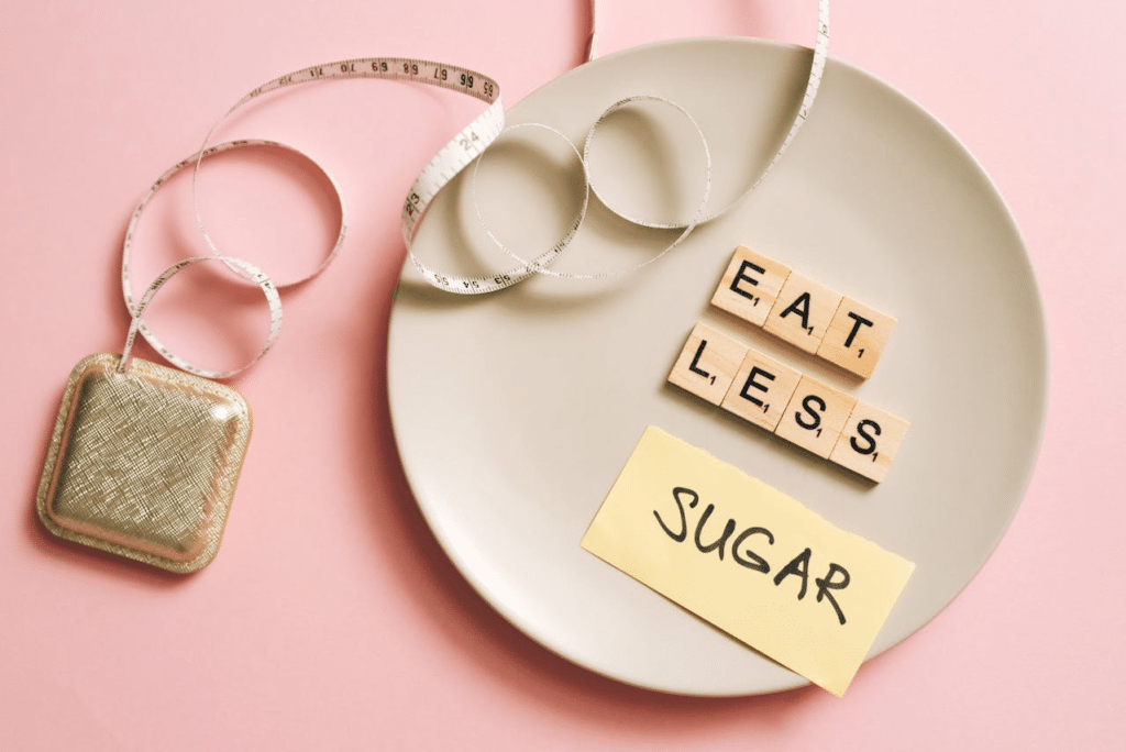 A plate with words indicating to eat less sugar