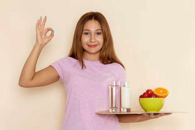 A woman with water and fruits