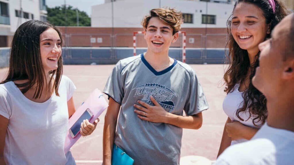 Teens together chatting and laughing