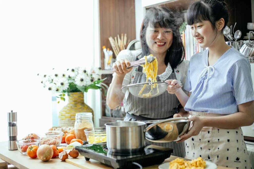 teen cooking with mom